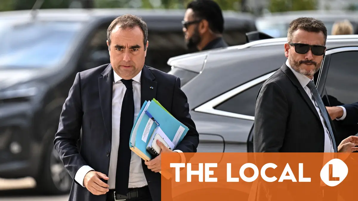 Residents jeer French PM on visit to fire-hit region